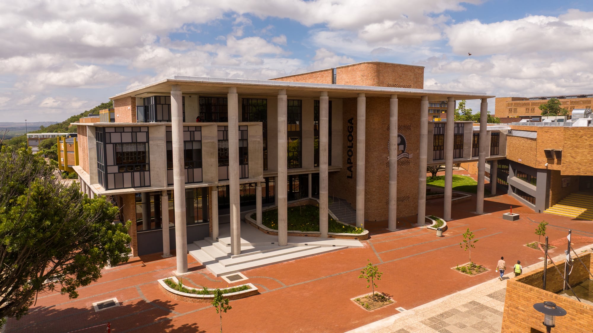 Exterior of the redeveloped university library, connected to the original building via a second-floor bridge